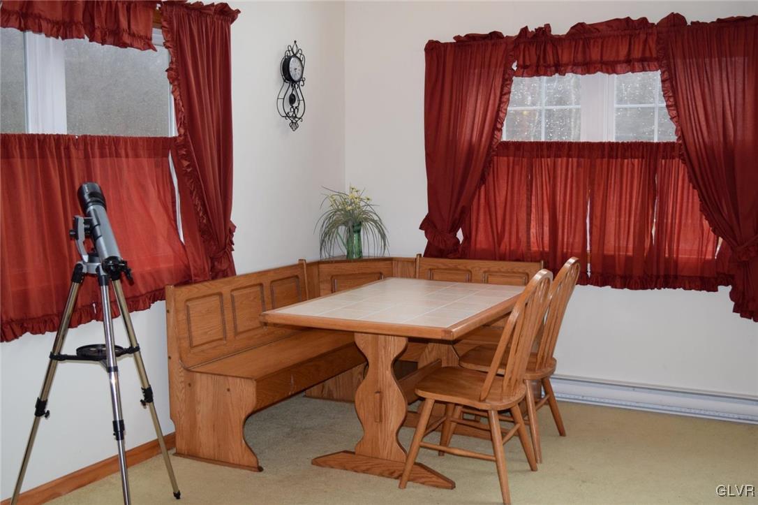 290 Brier Crest Road Blakeslee, PA 18610 - Photo 14 of 43 a view of a dining room with furniture and a window