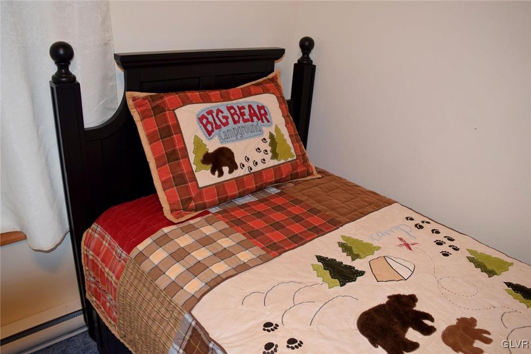 290 Brier Crest Road Blakeslee, PA 18610 - Photo 27 of 43 a bedroom with a bed and a painting on the wall