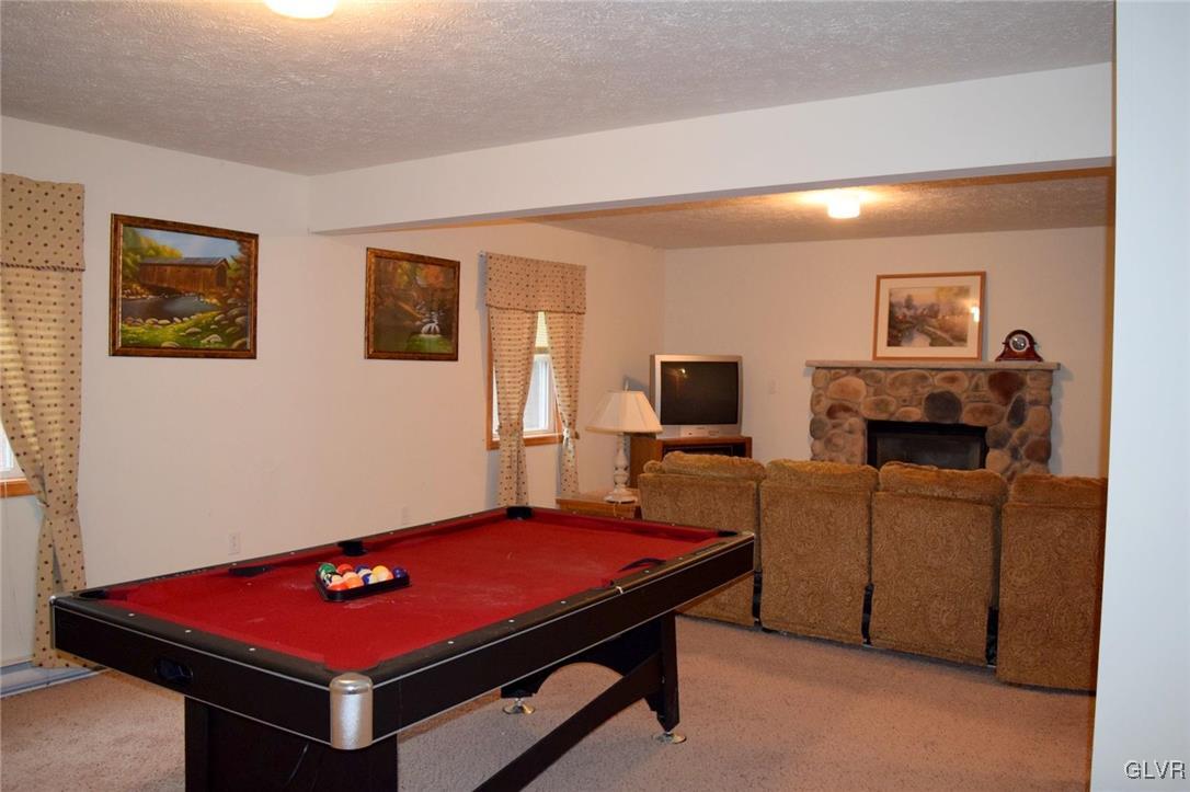 290 Brier Crest Road Blakeslee, PA 18610 - Photo 38 of 43 a room with furniture and flat screen tv