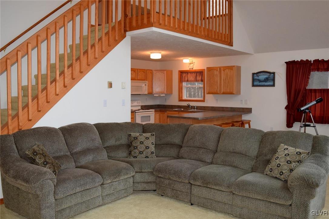 290 Brier Crest Road Blakeslee, PA 18610 - Photo 6 of 43 a living room with furniture and a flat screen tv
