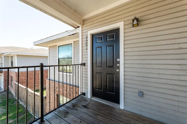 a view of a house with wooden deck