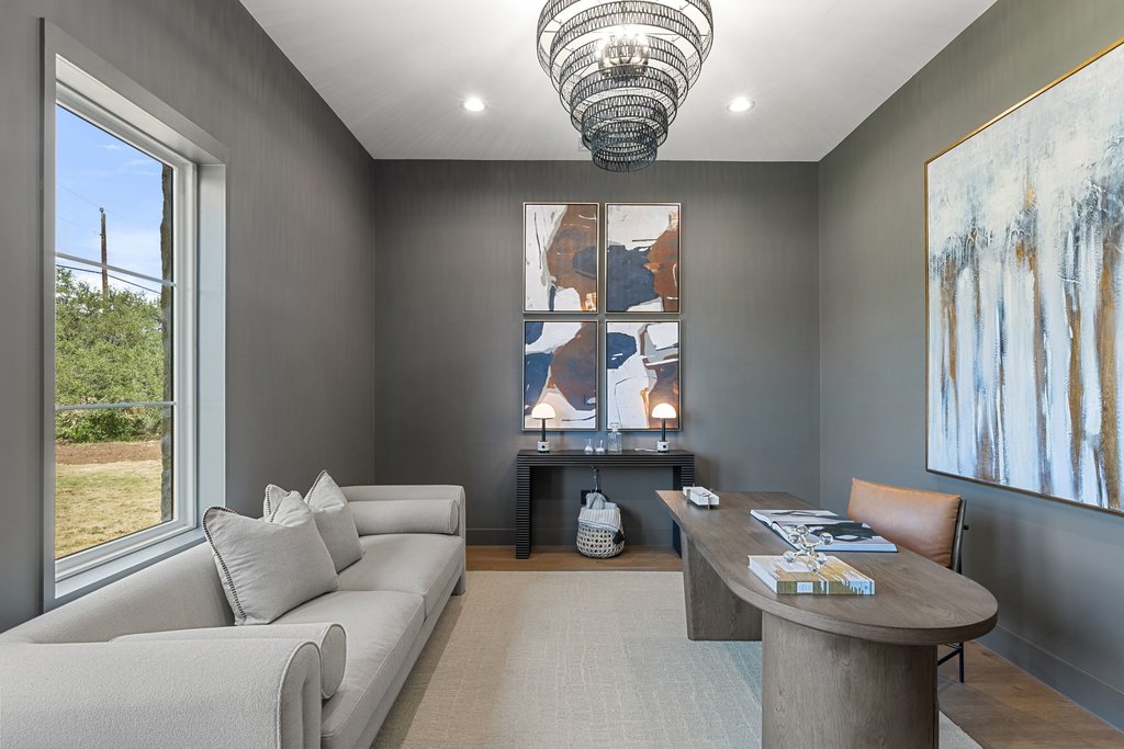 9207 Zyle Road Austin, TX 78737 - Photo 16 of 40 An inviting home office boasts a sophisticated palette and ample natural light, creating a productive atmosphere.