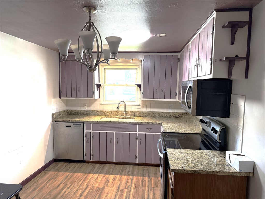 4732 Lehigh Drive Springfield, OH 45503 - Photo 7 of 27 This kitchen offers functional design with ample storage and countertop space for culinary endeavors.