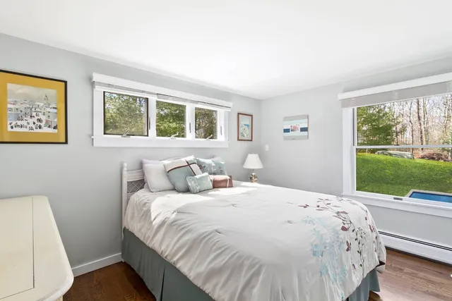 a bedroom with a bed and a view of outdoor