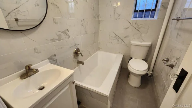 a bathroom with a sink and toilet