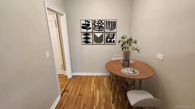 a view of a dinning room with furniture and wooden floor