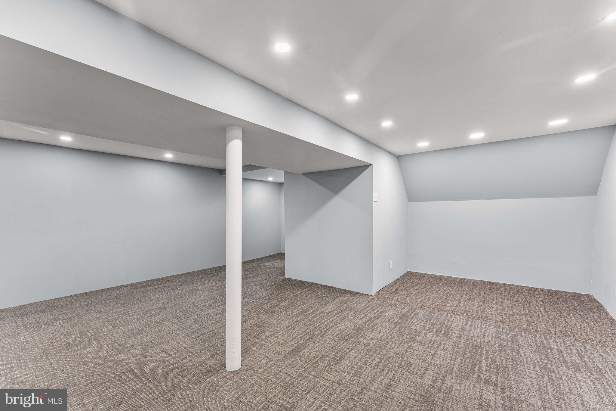 41 Zummo Way, Unit CONDO Norristown, PA 19401 - Photo 21 of 24 an empty room with a empty space and windows