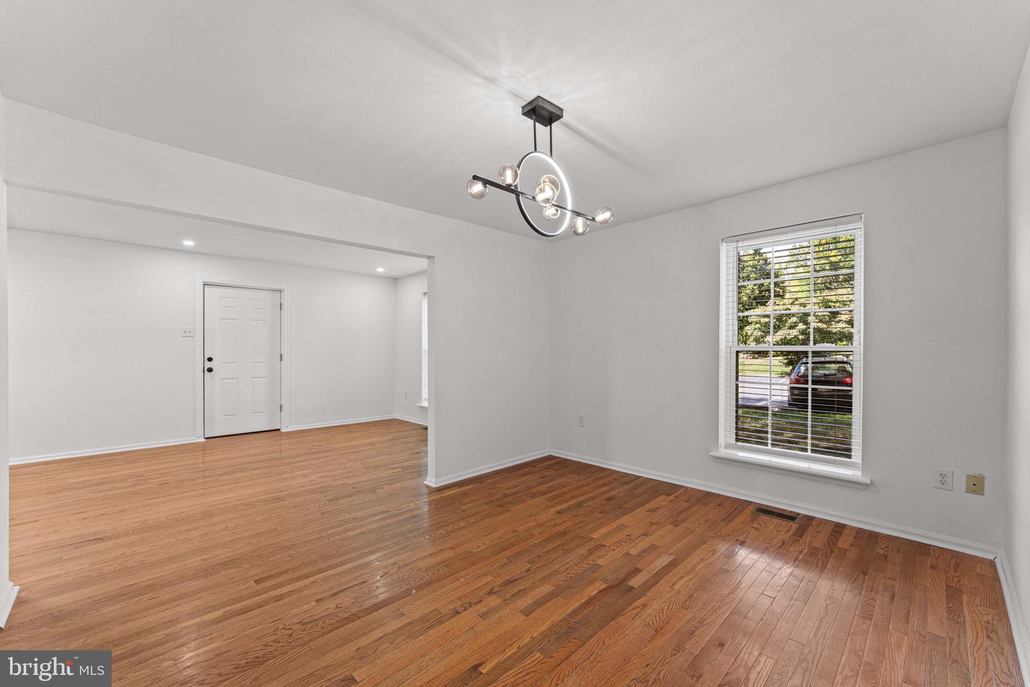 41 Zummo Way, Unit CONDO Norristown, PA 19401 - Photo 8 of 24 a view of an empty room with wooden floor and a window