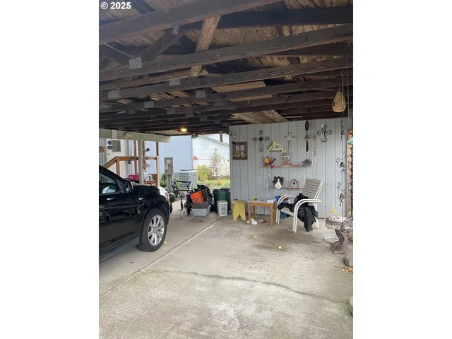 a view of a garage with parked cars