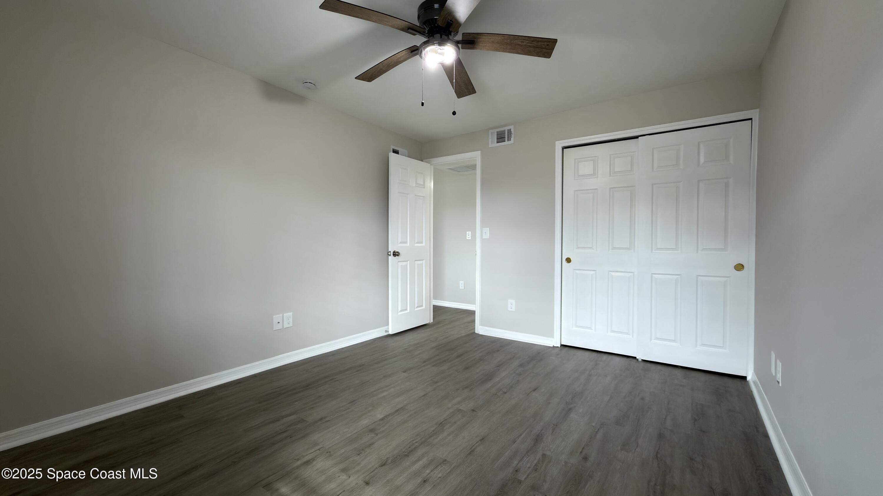 800 North Fiske Boulevard, Unit 709 Cocoa, FL 32922 - Photo 9 of 11 wooden floor in an empty room