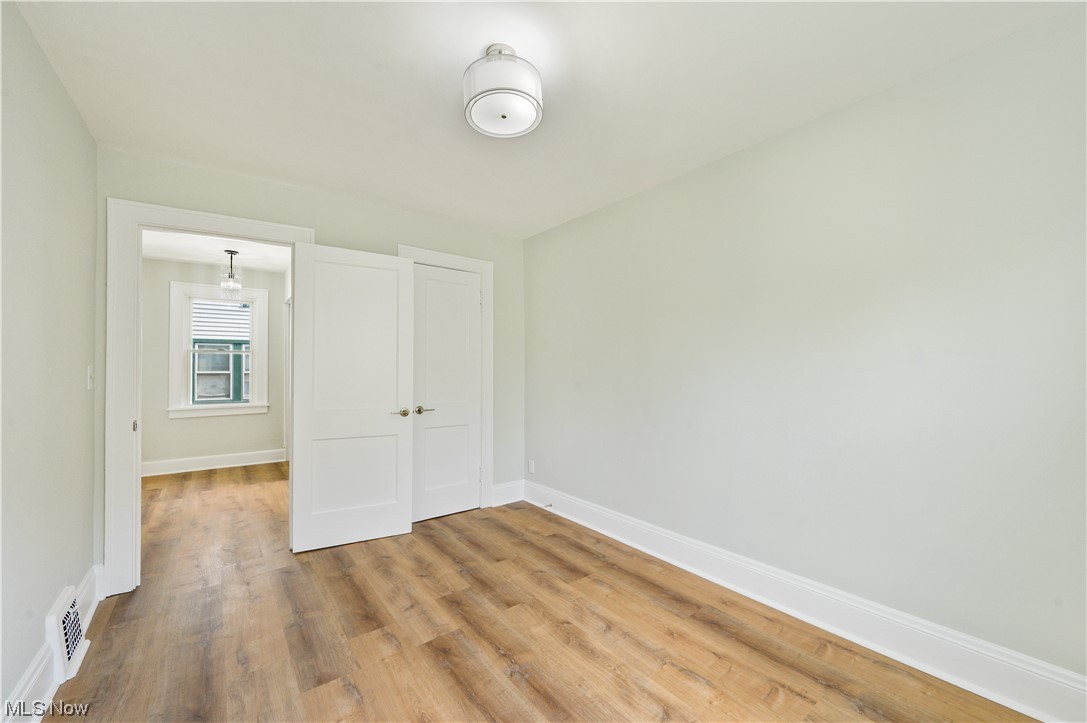 1606 Maple Road Cleveland Heights, OH 44121 - Photo 20 of 30 The 2nd floor offers 3 spacious bedrooms and newly updated full bathroom(2023) features bathtub, sliding shower doors, double sink vanity.