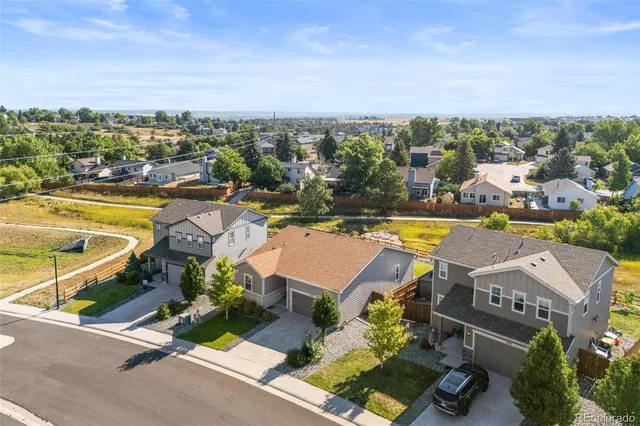 an aerial view of a swimming pool and lake view