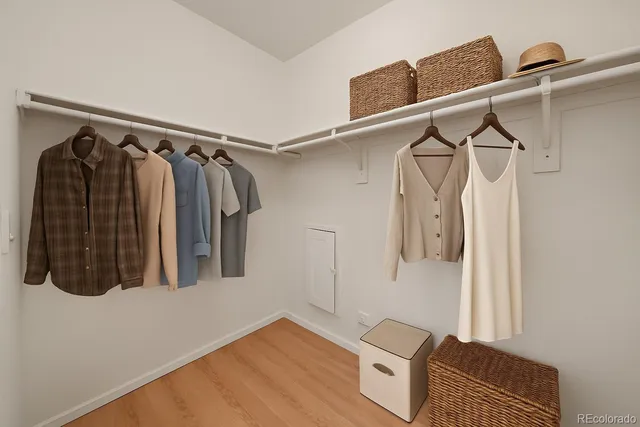 a bathroom with a granite countertop sink a toilet a mirror and bathtub