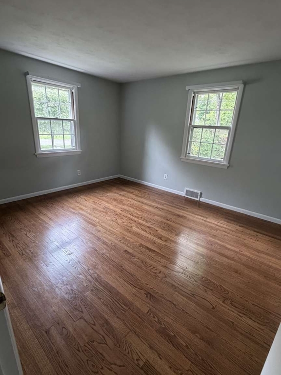 74 Birch Road Longmeadow, MA 01106 - Photo 14 of 38 an empty room with wooden floor and windows