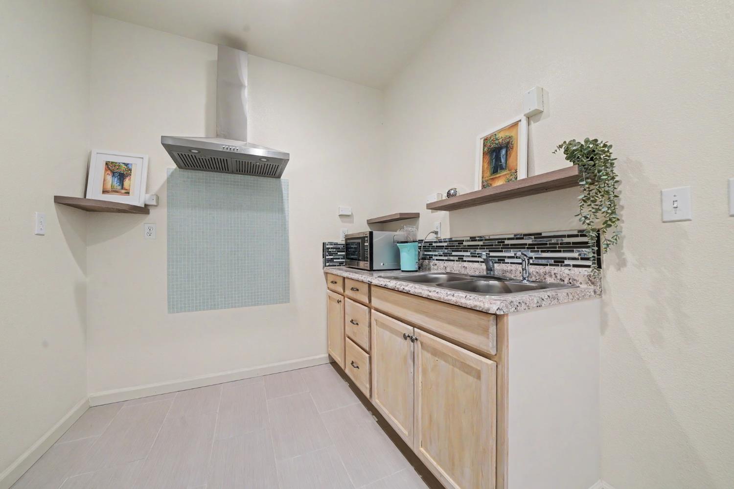 6066 Bluff View Road Copperopolis, CA 95228 - Photo 52 of 96 a kitchen with a sink and a stove