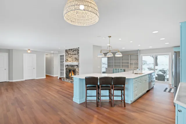 a kitchen with stainless steel appliances a stove a refrigerator and a oven