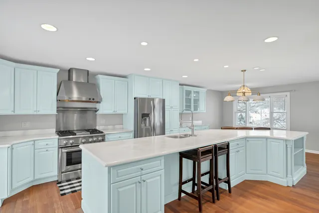 a kitchen with a table and chairs in it