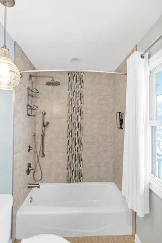 a view of an empty room with glass door