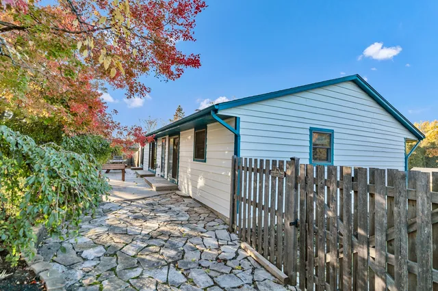 an aerial view of residential houses with outdoor space and swimming pool