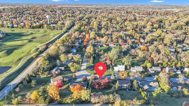 an empty room with furniture fireplace and wooden floor