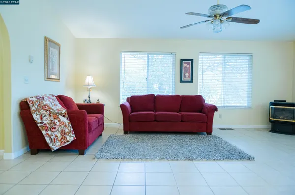a living room with furniture and a window