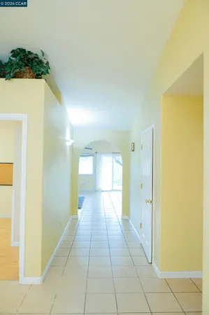 a view of a hallway with a bathroom