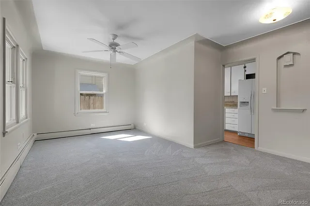 a view of an empty room with a window