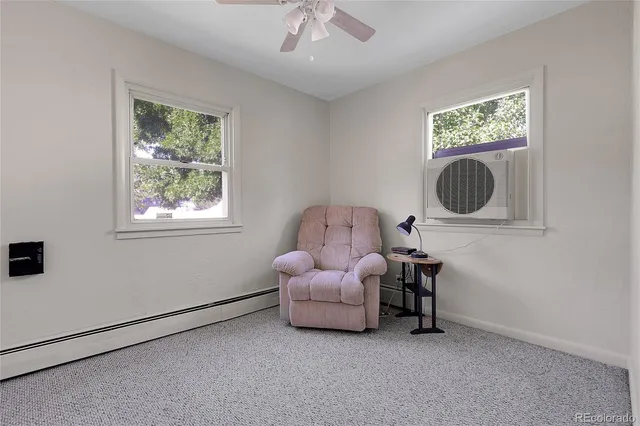 a living room with furniture and a window