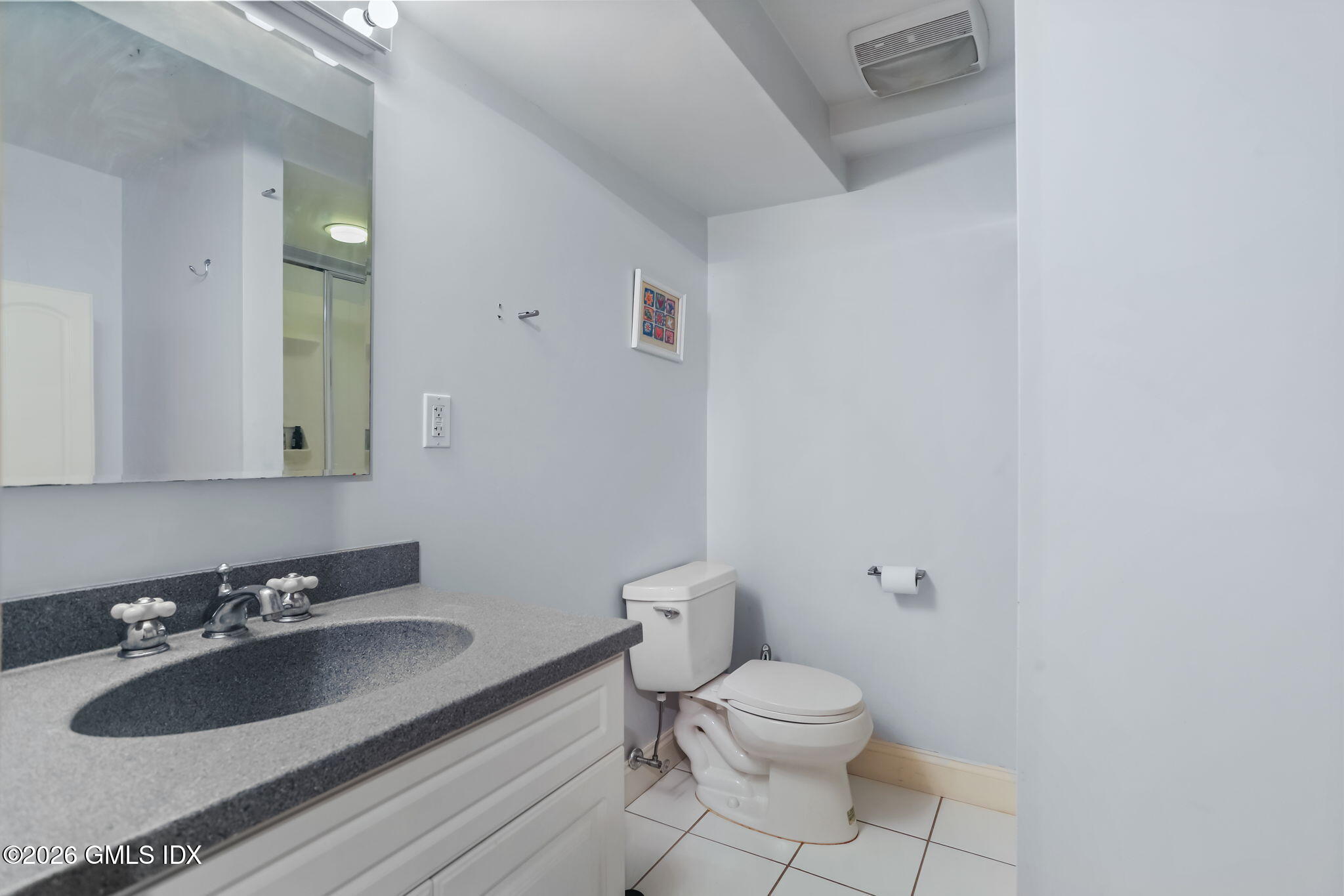153 Lockwood Road Riverside, CT 06878 - Photo 44 of 58 a bathroom with a sink toilet and mirror