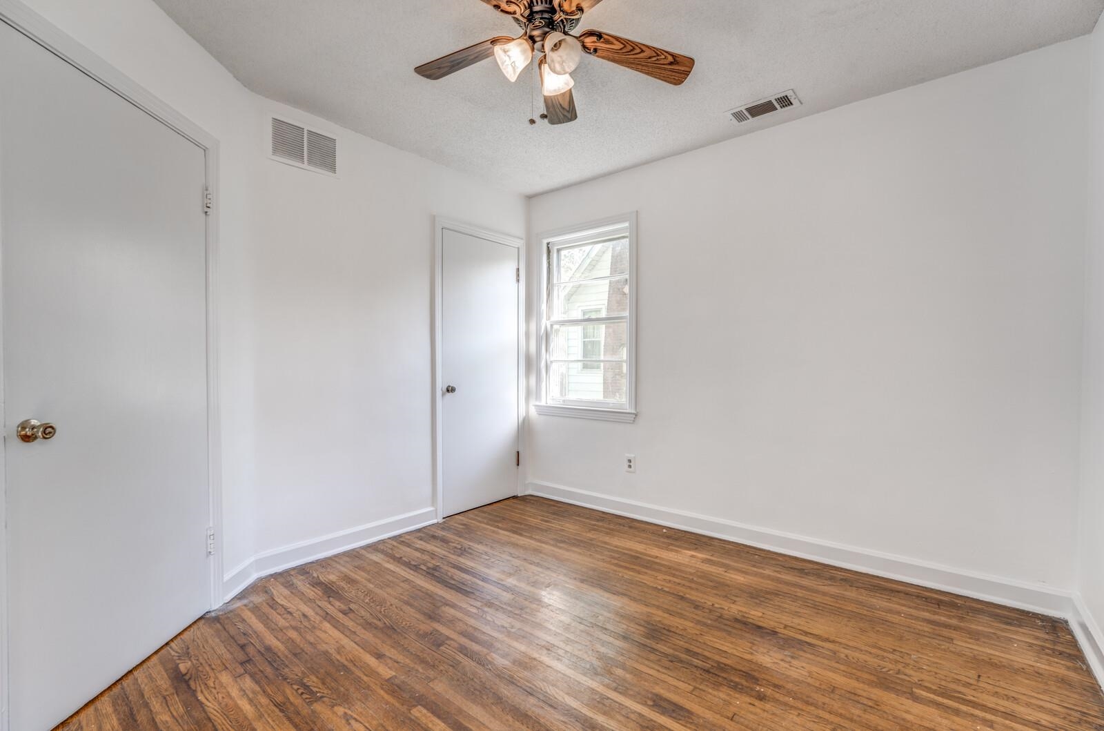 805 North Perkins Road Memphis, TN 38122 - Photo 32 of 40 wooden floor in an empty room with a window