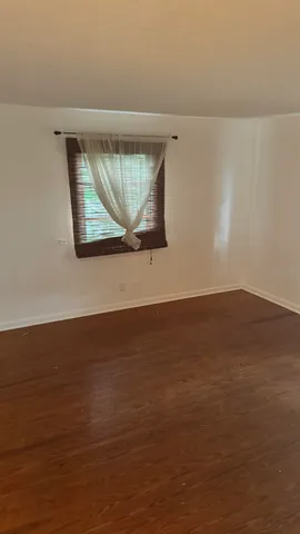 a view of wooden floor and cabinet