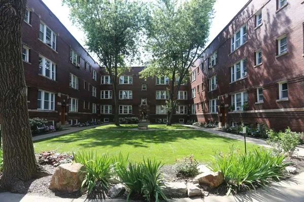 a view of a building with a yard