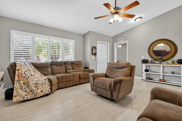 a living room with furniture and a large window