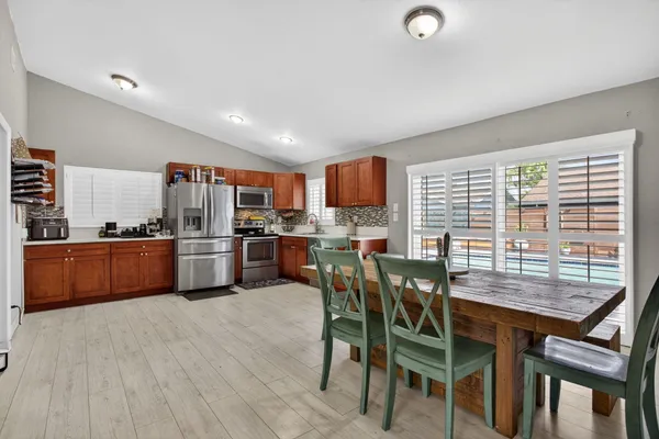 a dining room with furniture and window