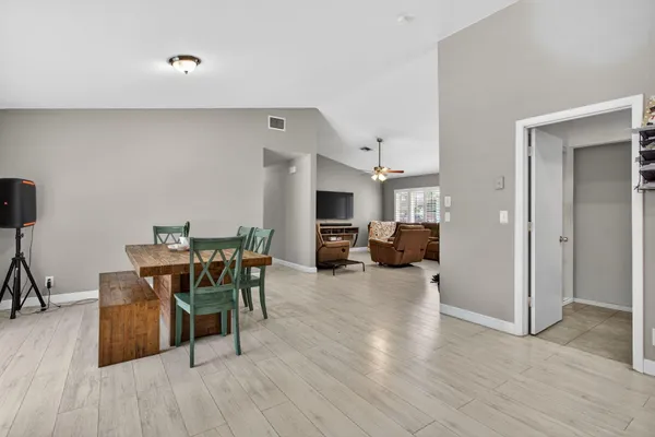 a view of a livingroom with furniture and wooden floor