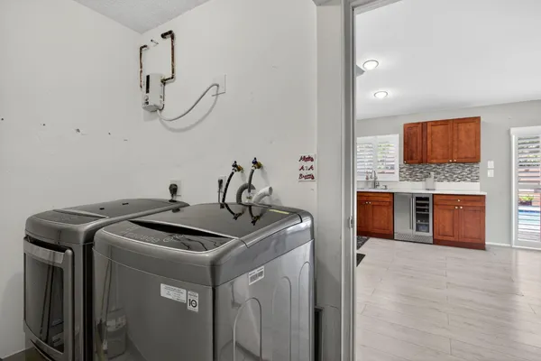 a utility room with washer and dryer