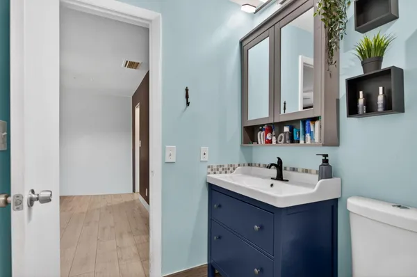 a bathroom with a sink double vanity and a mirror