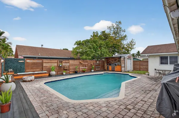 a view of a swimming pool with a lounge chairs