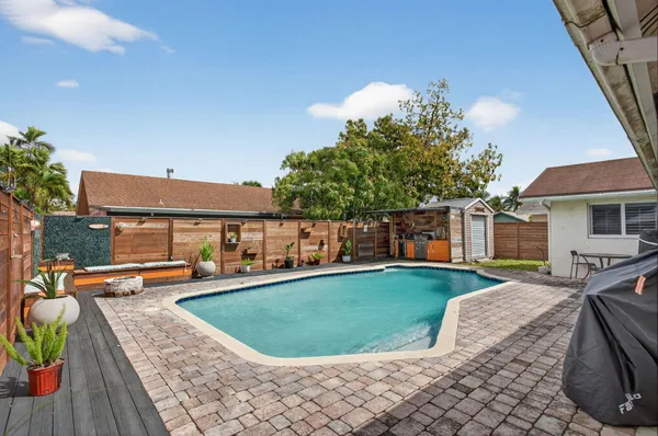 a view of a backyard with sitting area