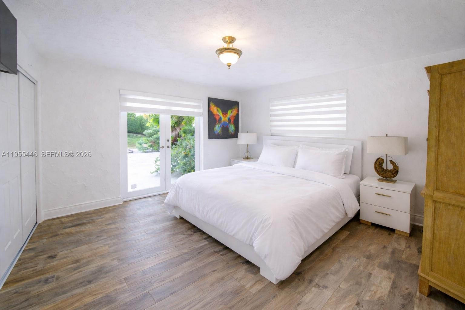 241 Southwest 129th Avenue Miami, FL 33184 - Photo 15 of 28 a bedroom with a bed and a window