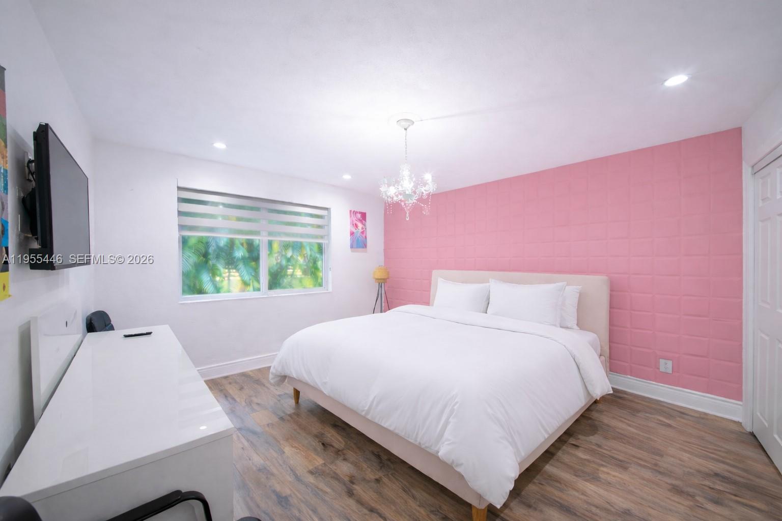 241 Southwest 129th Avenue Miami, FL 33184 - Photo 16 of 28 a bedroom with a bed and a flat screen tv