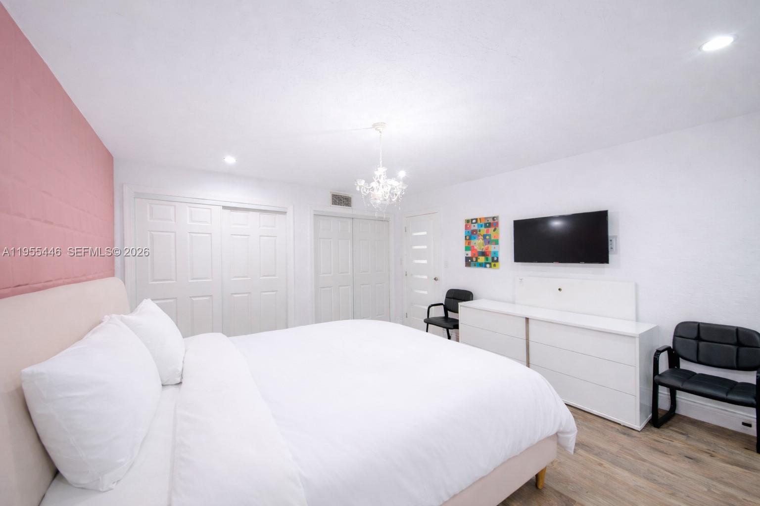 241 Southwest 129th Avenue Miami, FL 33184 - Photo 17 of 28 a bedroom with a bed and a flat screen tv