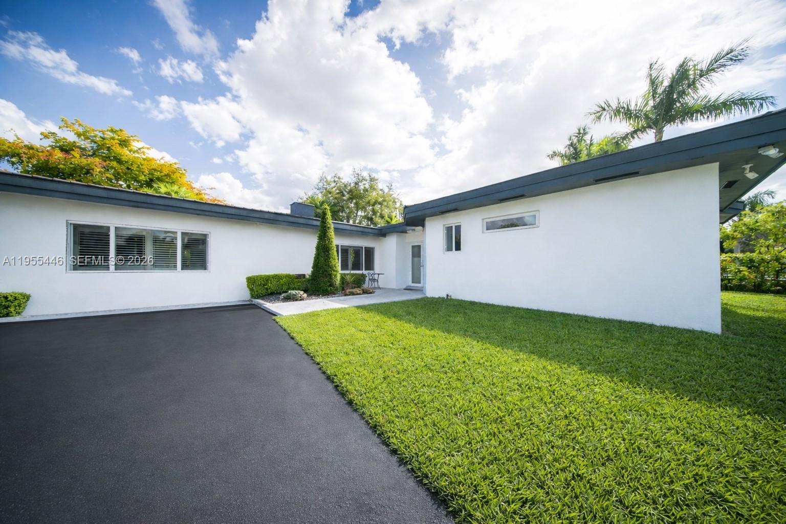 241 Southwest 129th Avenue Miami, FL 33184 - Photo 3 of 28 a house view with a garden space