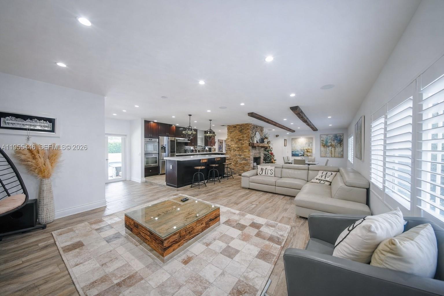 241 Southwest 129th Avenue Miami, FL 33184 - Photo 5 of 28 a living room with furniture and a rug