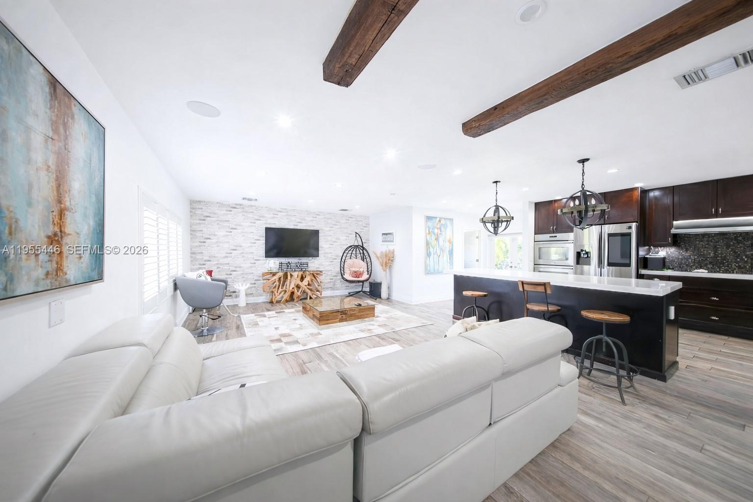241 Southwest 129th Avenue Miami, FL 33184 - Photo 6 of 28 a living room with fireplace furniture and a flat screen tv