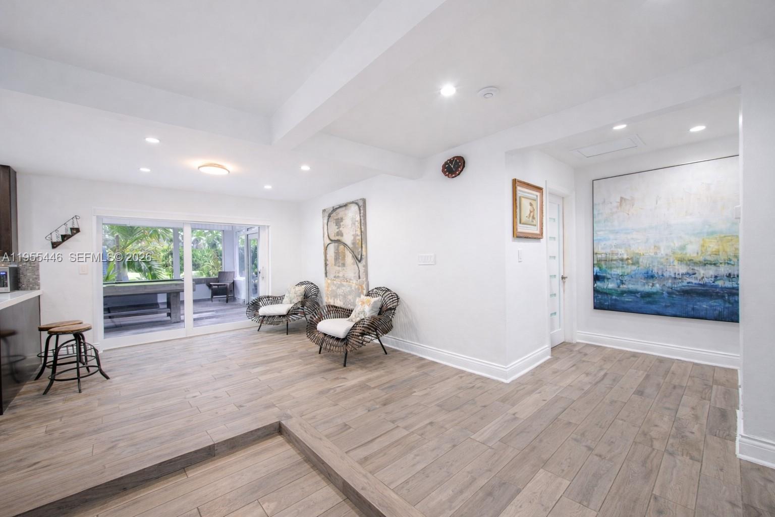 241 Southwest 129th Avenue Miami, FL 33184 - Photo 7 of 28 a living room with furniture and a wooden floor