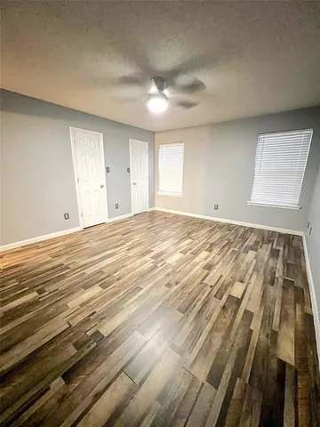 a view of room with wooden floor