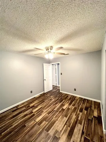a view of room with wooden floor
