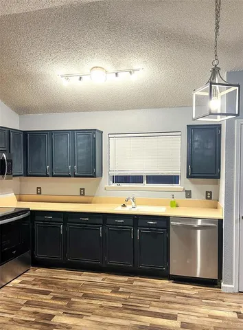 a view of a kitchen with a tub and a sink