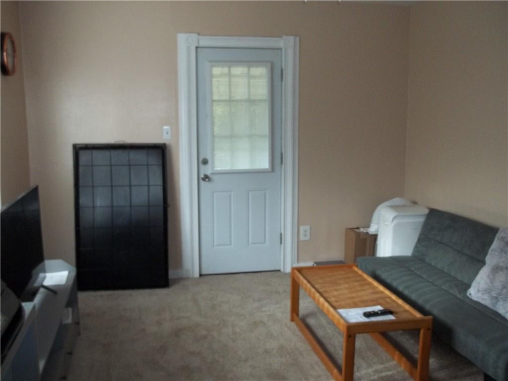 402 McCoy Road McKees Rocks, PA 15136 - Photo 3 of 20 a living room with furniture and a flat screen tv